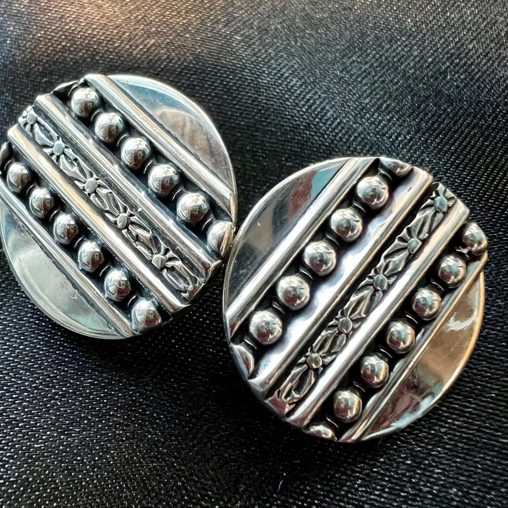Round Clip On sterling earrings.